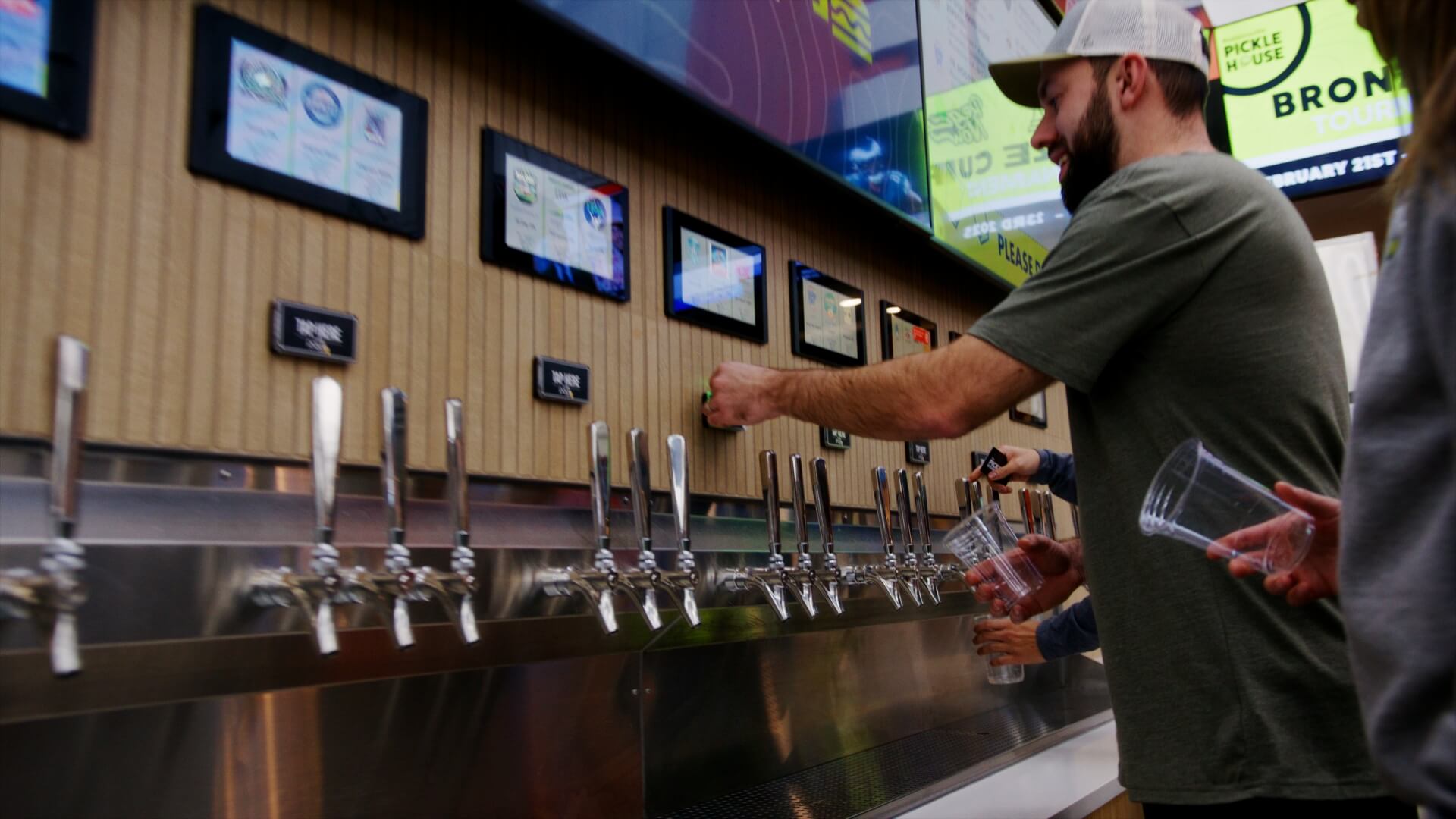 Choosing a drink at the tap wall