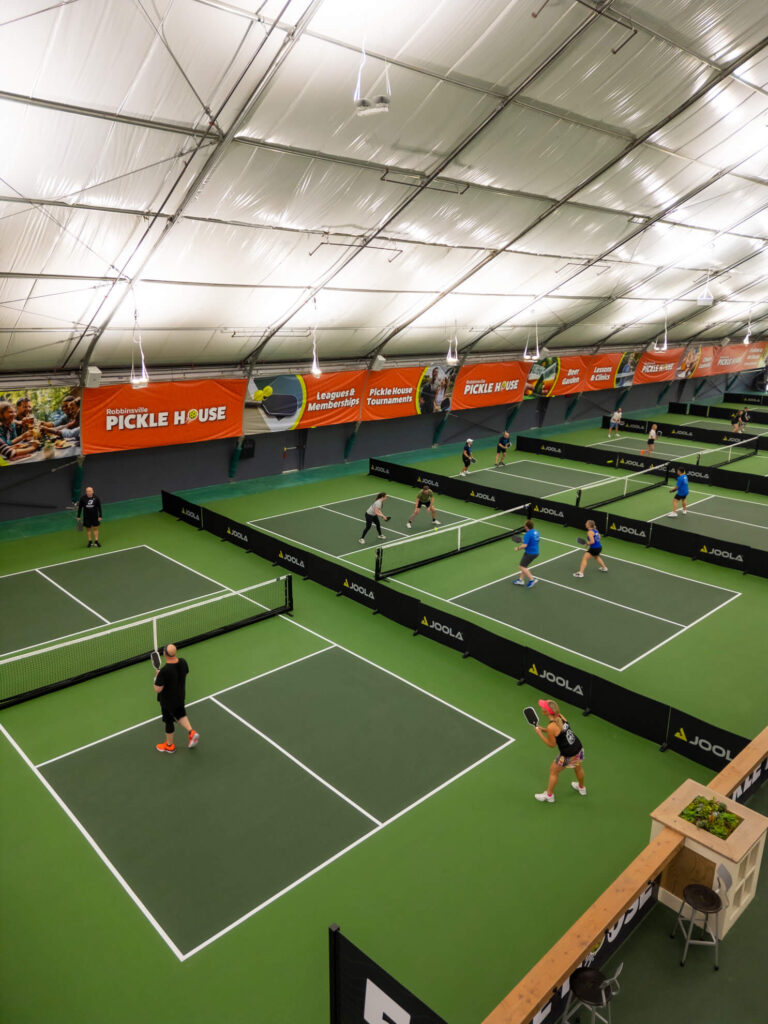 Pickle House tournament players on the pickleball court