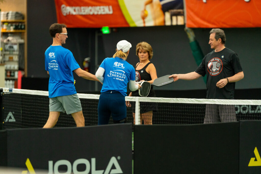 Pickle House tournament players on the pickleball court