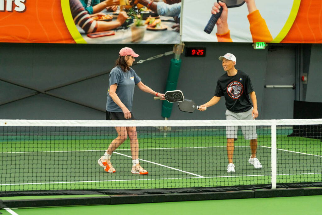 Pickle House tournament players on the pickleball court