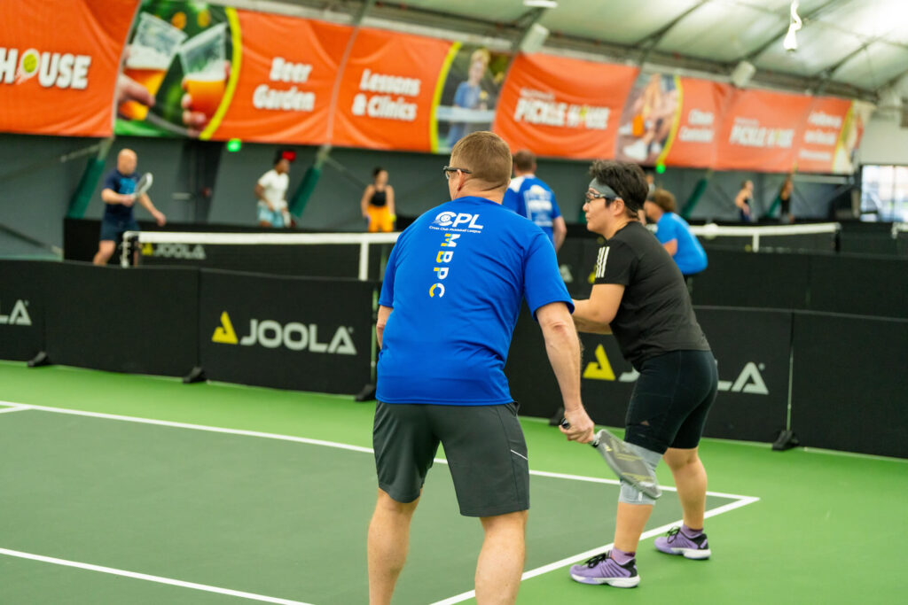 Pickle House tournament players on the pickleball court