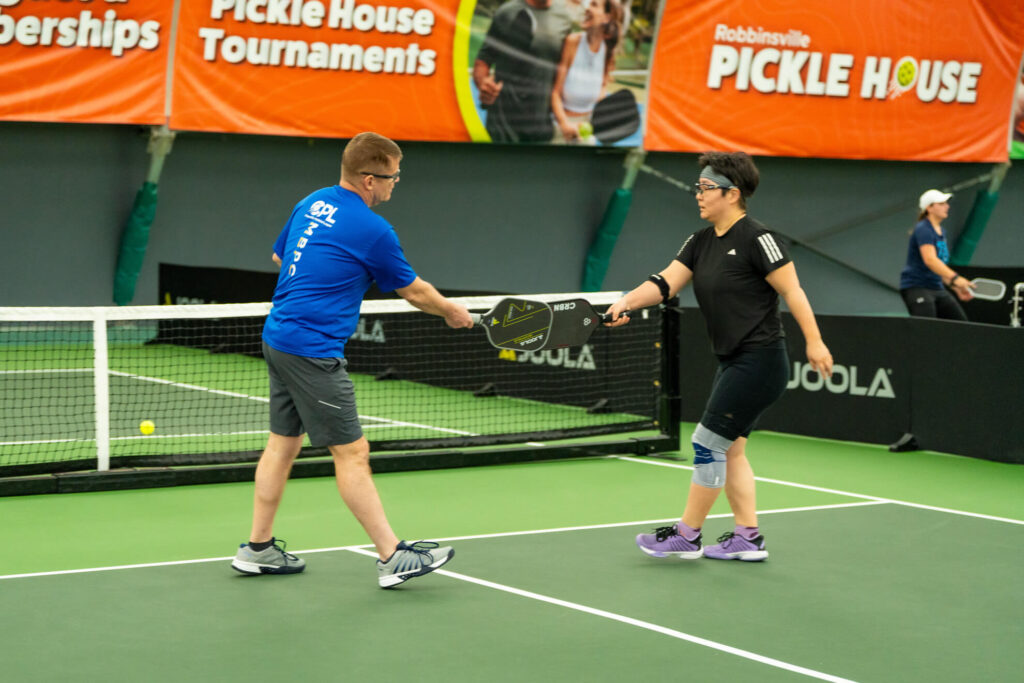 Pickle House tournament players on the pickleball court
