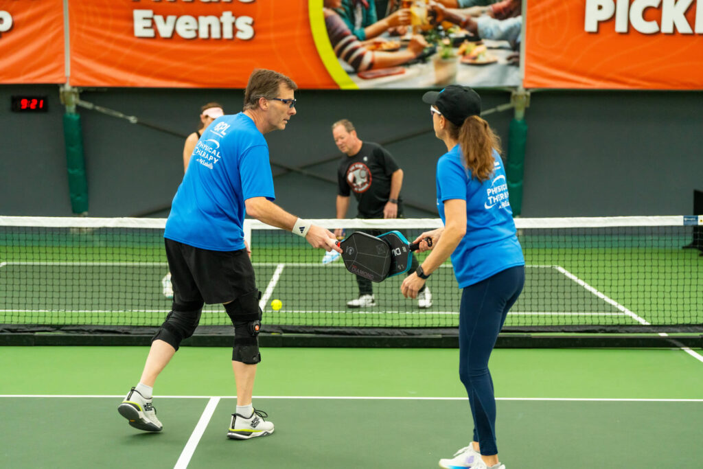 Pickle House tournament players on the pickleball court