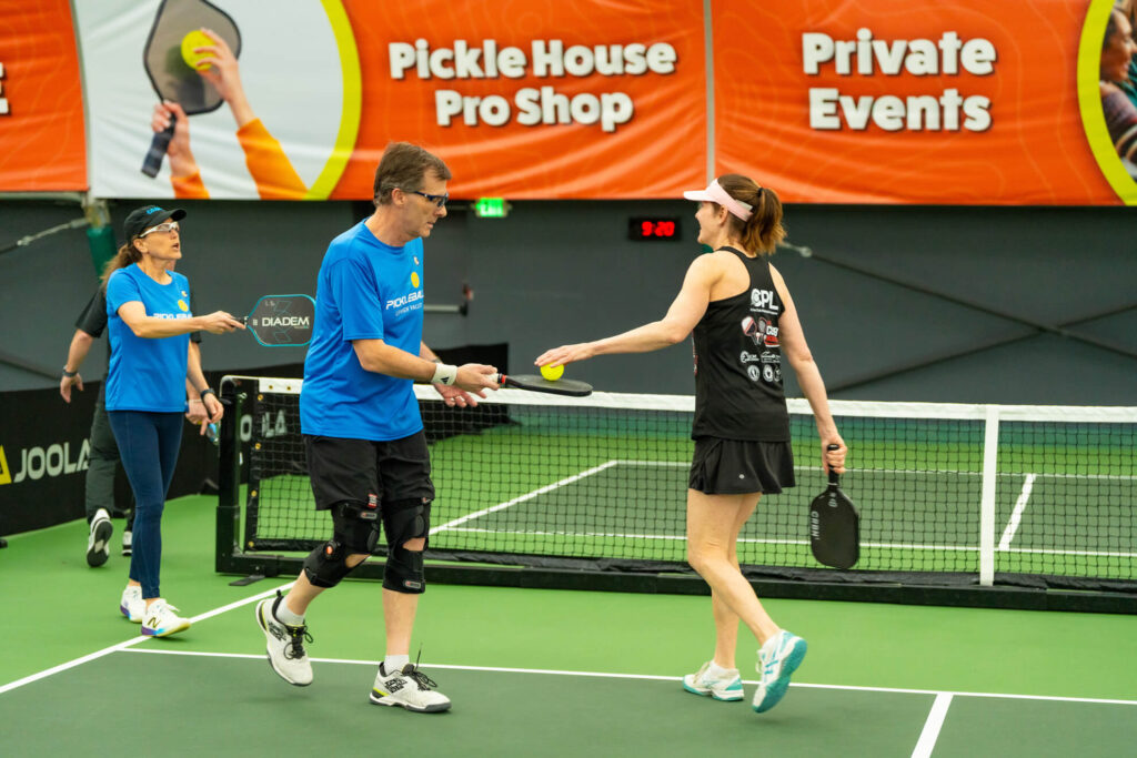 Pickle House tournament players on the pickleball court