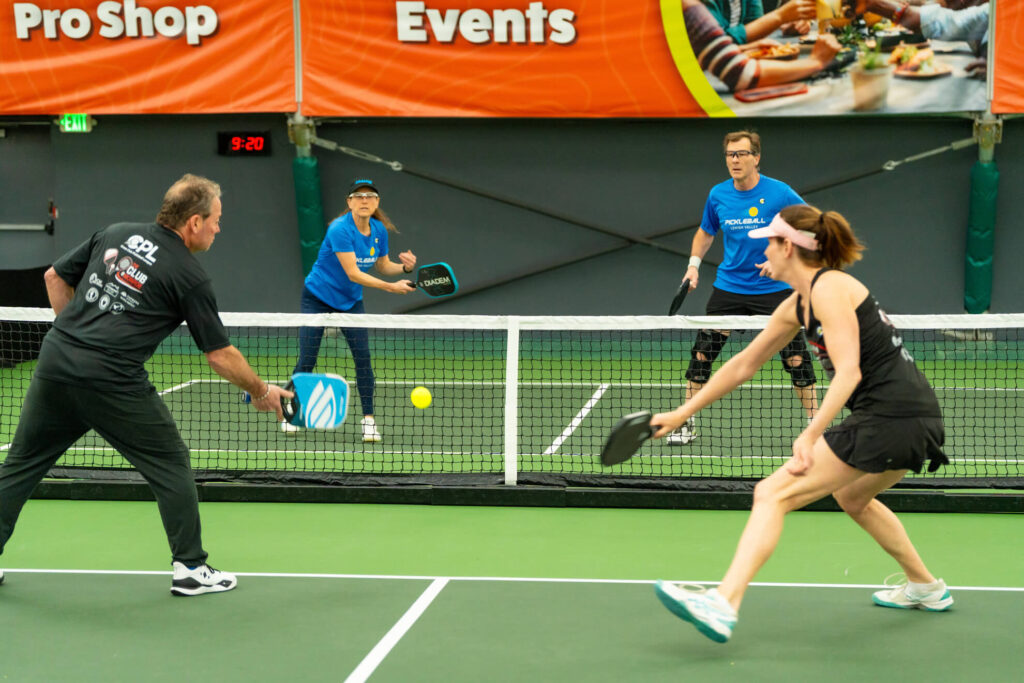 Pickle House tournament players on the pickleball court
