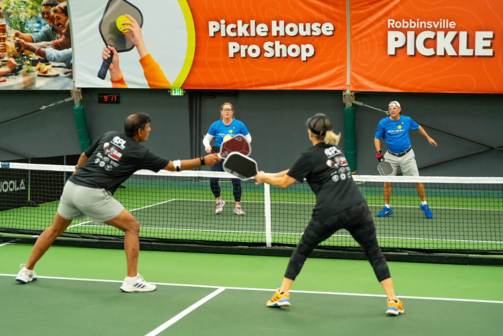Pickle House tournament players on the pickleball court